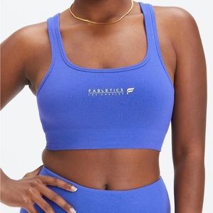 Fabletics sports bra new with tags, original packaging. Size XS, seamless blue